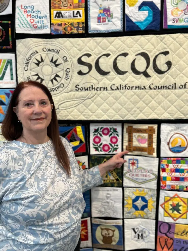 peggy with guild logo at road